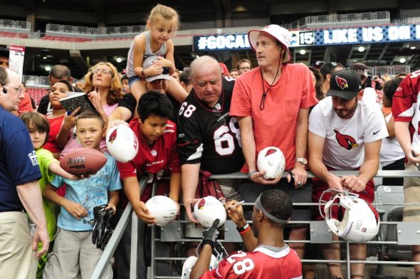 Jul 26, 2014; Tempe, AZ, USA; Arizona Cardinals cornerback Justin Bethel (28) signs autographs for fans during training camp at University of Phoenix. Mandatory Credit: Matt Kartozian-USA TODAY Sports